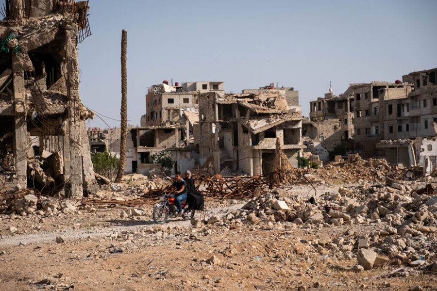 Darayya, Syria - April, 2022: People in destroyed city of Darayya after the Syrian Civil War.